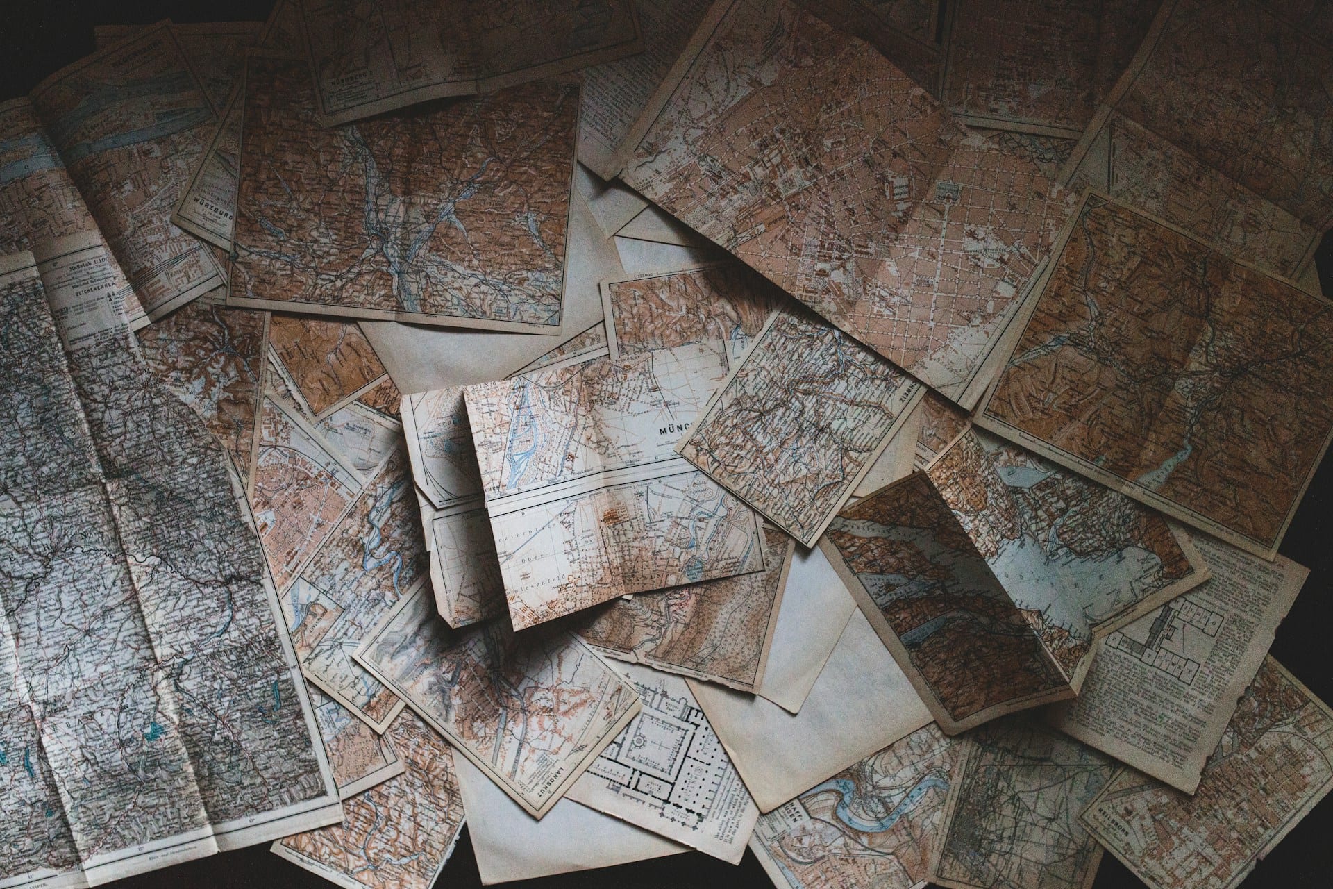 Table with layers of scattered maps.