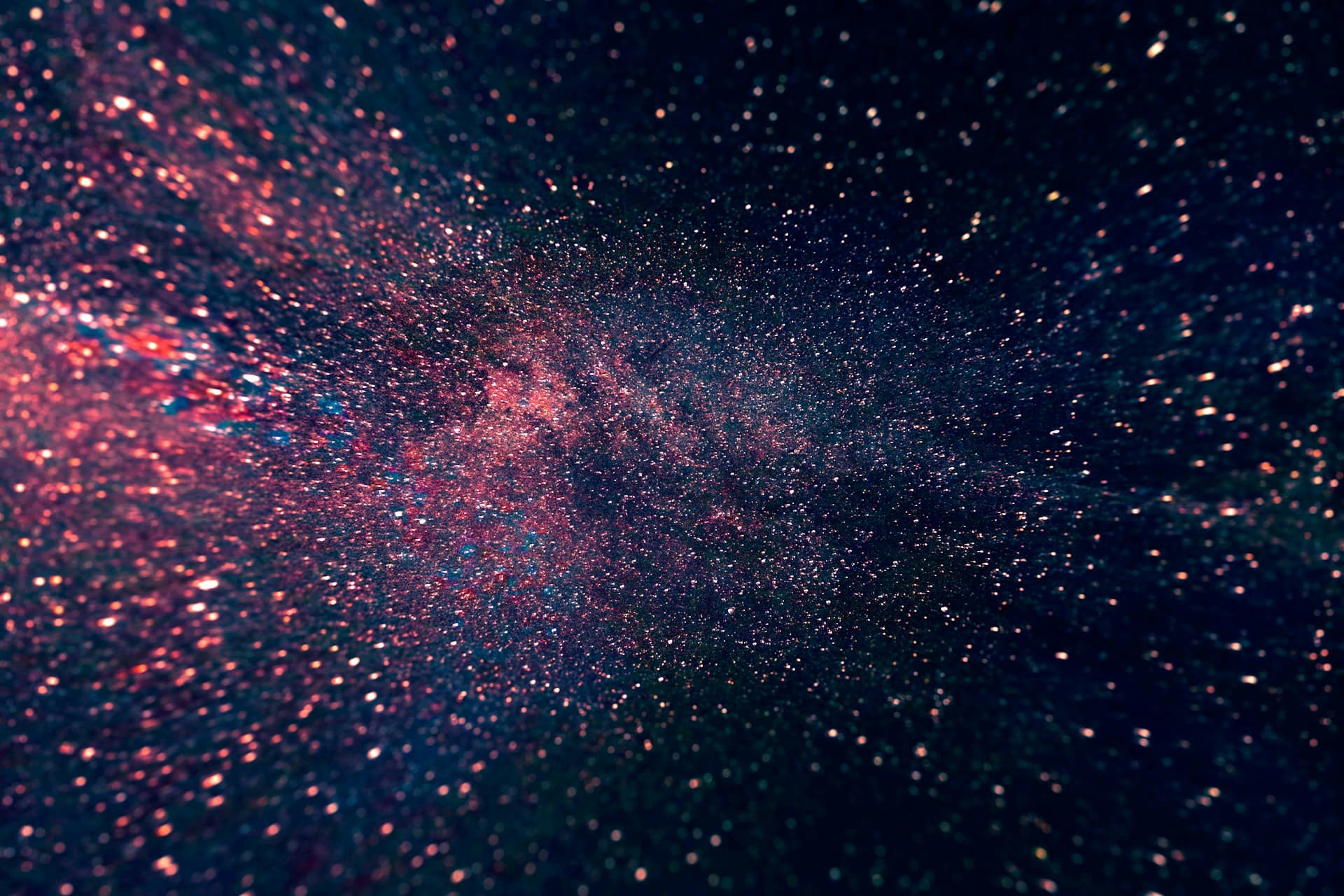 Tiny red and blue dots splashed across black background